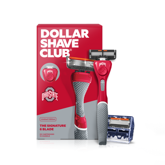 Dollar Shave Club Ohio State University grooming kit on a white background. Includes a scarlet razor handle with the OSU Buckeyes logo, 24 blades, Shave Butter, Prep Scrub, a black 3-in-1 electric trimmer, and a black traveler case.