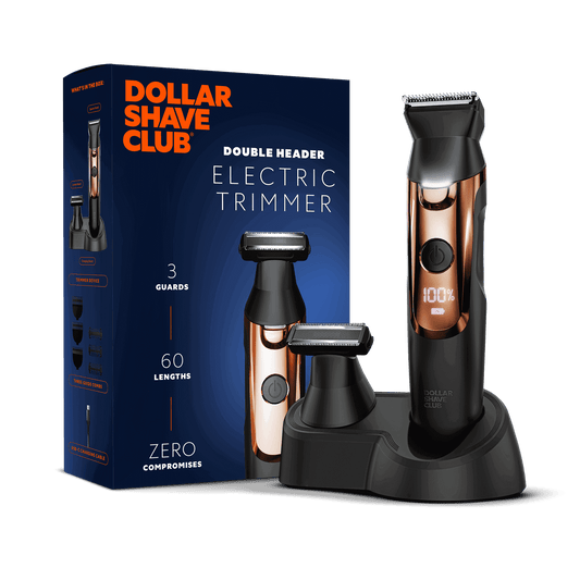 Dollar Shave Club electric trimmer with packaging on a black background