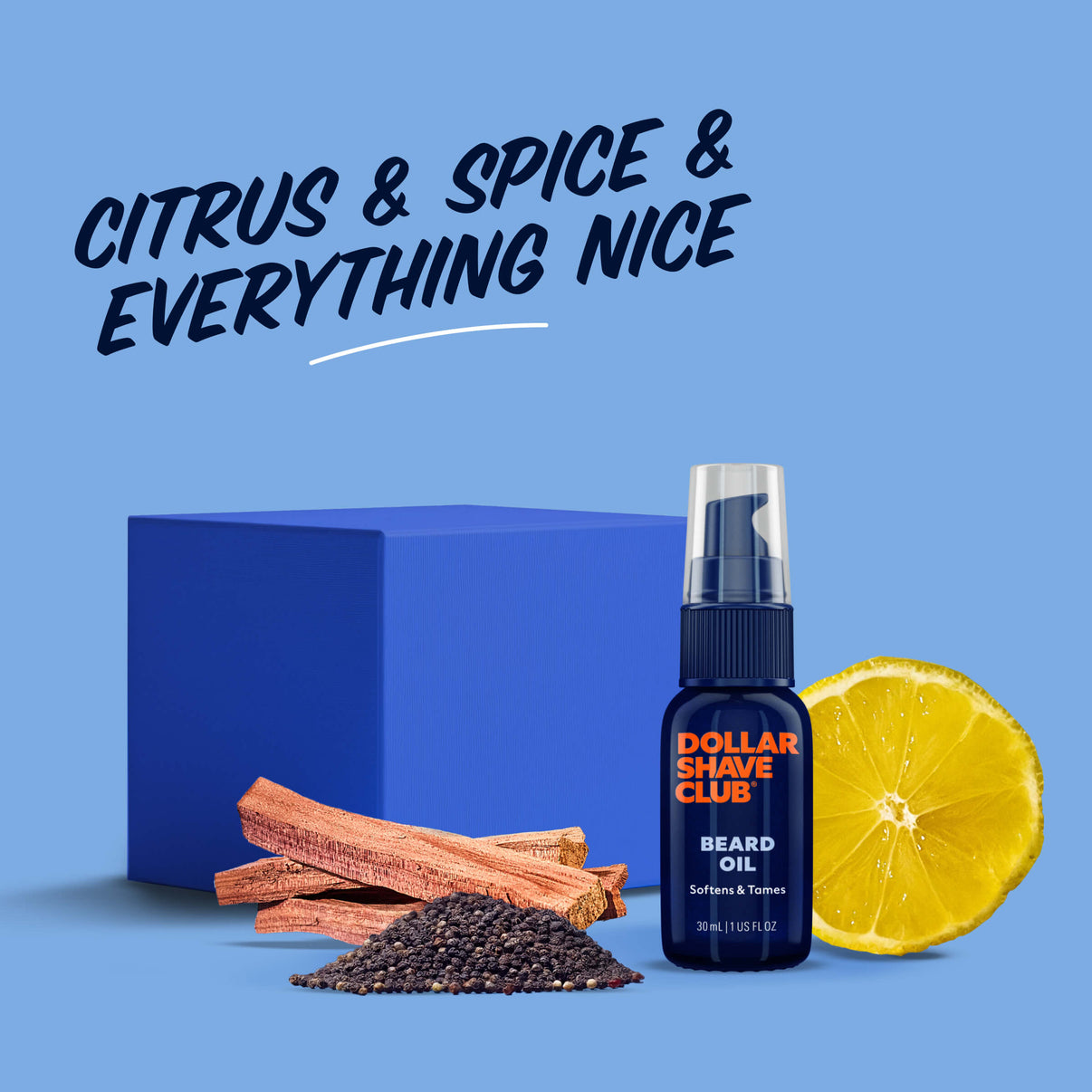 Dollar Shave Club beard oil bottle with lemon, cinnamon, and black pepper on a blue background