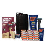 Dollar Shave Club Florida State University grooming kit on a white background. Includes a garnet razor handle with the FSU Seminoles logo, 24 blades, Shave Butter, Prep Scrub, a black 3-in-1 electric trimmer, and a black traveler case.