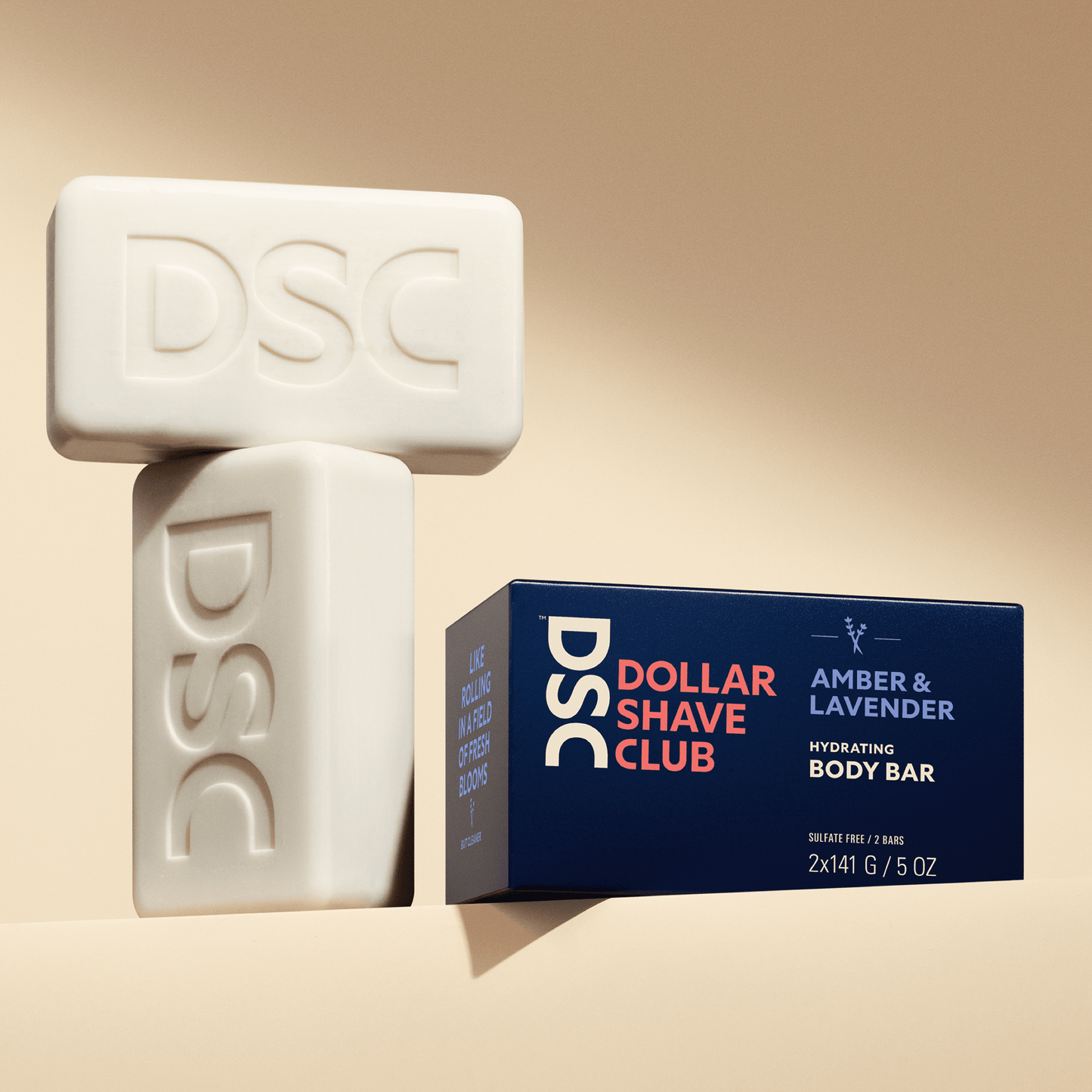 Dollar Shave Club Body Bars Amber Lavender against tan backdrop.